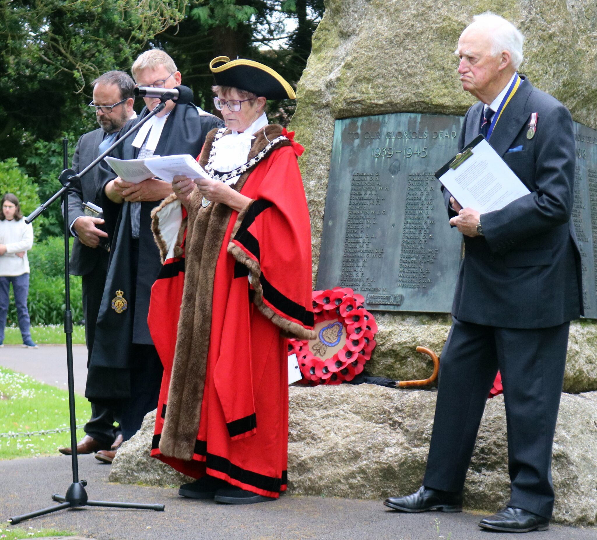 Mayor Janet Lloyd reads a speech while Royal British Legion Branch President Michael Rose stands to her left.